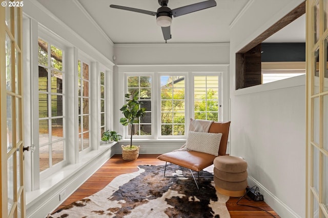 4000 NE Hassalo St, Portland, OR 97232 - sunroom / solarium featuring plenty of natural light, wood finished floors, and ornamental molding