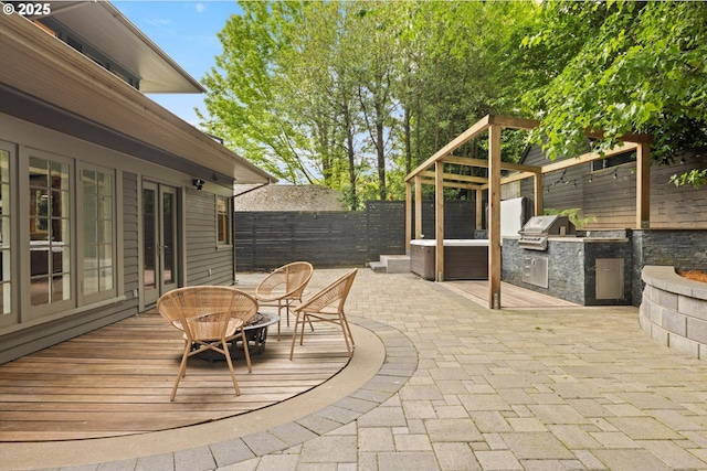 4000 NE Hassalo St, Portland, OR 97232 - fenced backyard with a wooden deck, a patio, and outdoor dining area
