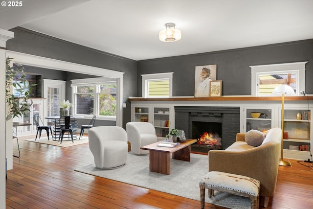 4000 NE Hassalo St, Portland, OR 97232 - living area featuring hardwood / wood-style flooring and a brick fireplace