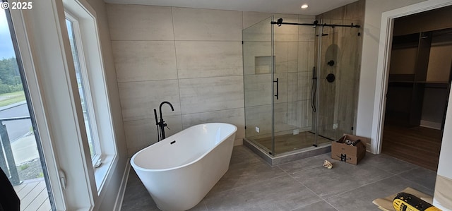 243 NE Hemmingway Dr, Stevenson, WA 98648 - bathroom featuring a freestanding bath, a stall shower, a walk in closet, and recessed lighting