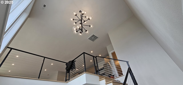 243 NE Hemmingway Dr, Stevenson, WA 98648 - stairway with a high ceiling and a chandelier