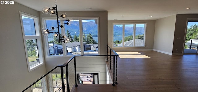 243 NE Hemmingway Dr, Stevenson, WA 98648 - staircase with a chandelier, wood finished floors, plenty of natural light, and recessed lighting