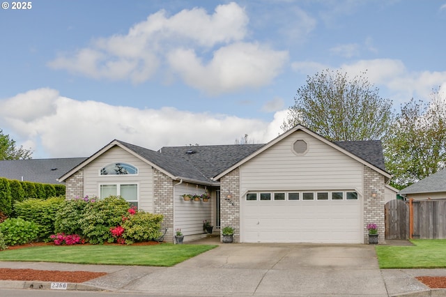 ranch-style home with a garage, fence, concrete driveway, and brick siding