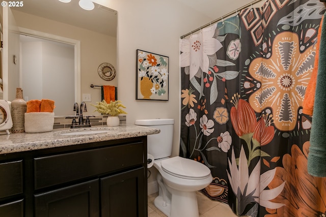 full bathroom featuring toilet, tile patterned floors, and vanity