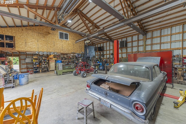 217 Mulkey Ln, Ariel, WA 98603 - garage featuring a workshop area and metal wall