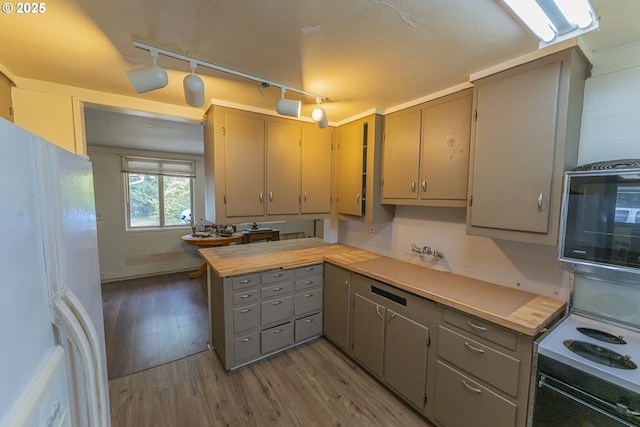 217 Mulkey Ln, Ariel, WA 98603 - kitchen with white appliances, gray cabinets, wood finished floors, track lighting, and a peninsula