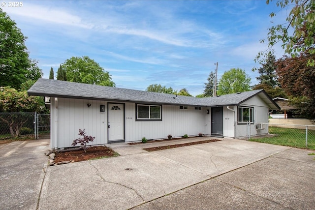 single story home featuring fence and a gate