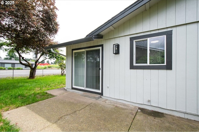 rear view of house featuring a patio area and fence
