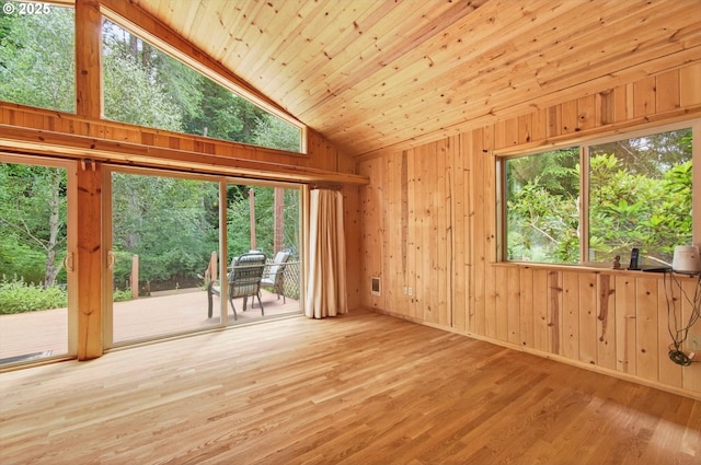 10268 Field Crest Dr, Birkenfeld, OR 97016 - empty room featuring vaulted ceiling, wood finished floors, and wooden walls