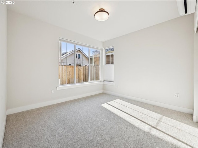 spare room featuring carpet floors