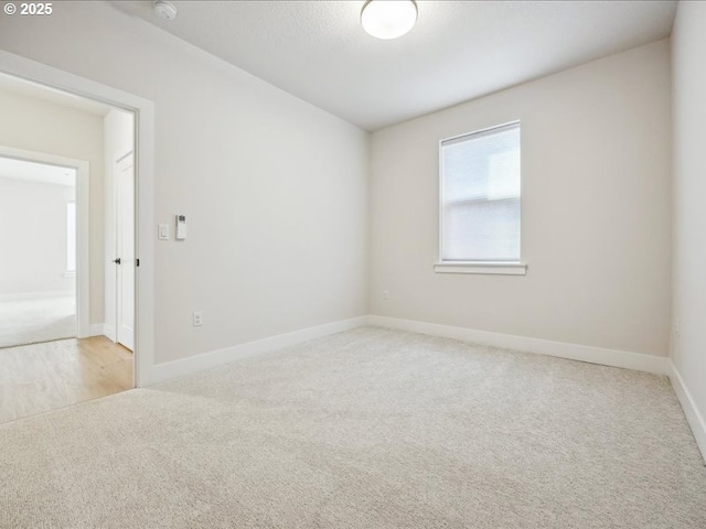 empty room with light colored carpet