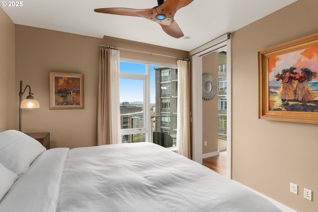 bedroom with access to exterior and ceiling fan