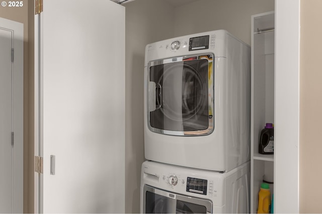 laundry room featuring stacked washer / dryer