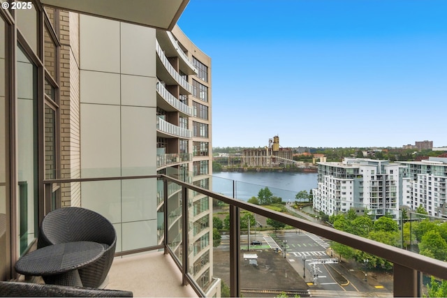 balcony featuring a water view
