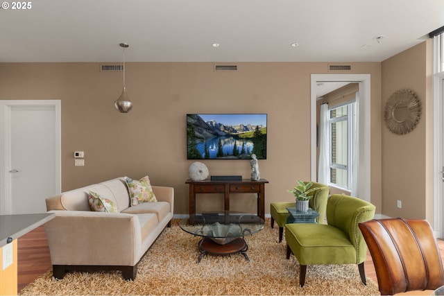 living area featuring baseboards