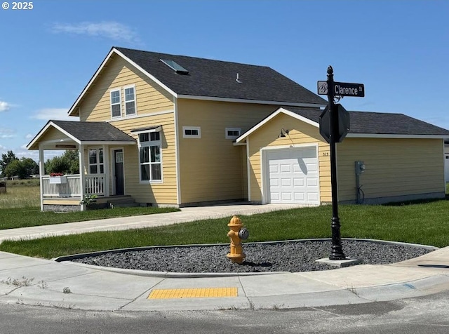 313 Art Kegler Blvd, Boardman, OR 97818 - traditional-style house featuring a garage, a front yard, driveway, and covered porch