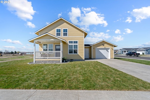 313 Art Kegler Blvd, Boardman, OR 97818 - traditional-style home featuring a porch, driveway, an attached garage, and a front yard