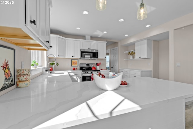 313 Art Kegler Blvd, Boardman, OR 97818 - kitchen with appliances with stainless steel finishes, a sink, open shelves, recessed lighting, and light stone countertops