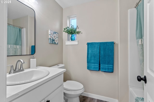 313 Art Kegler Blvd, Boardman, OR 97818 - full bath featuring vanity, toilet, wood finished floors, and baseboards