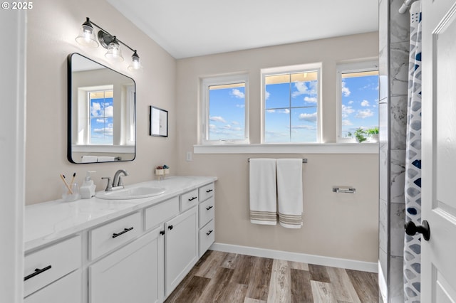 313 Art Kegler Blvd, Boardman, OR 97818 - bathroom featuring vanity, wood finished floors, and baseboards