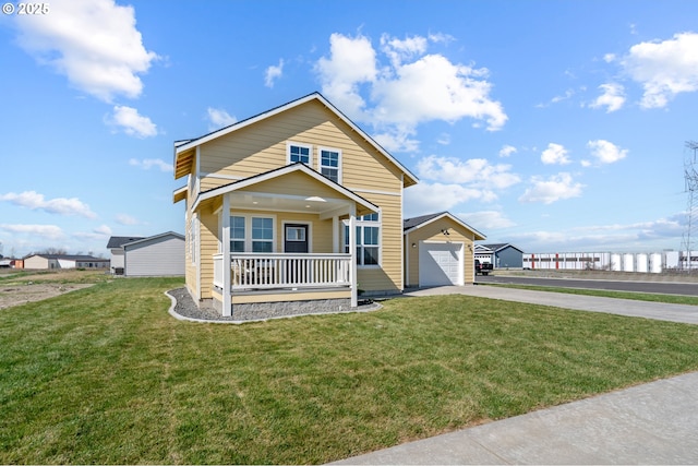 313 Art Kegler Blvd, Boardman, OR 97818 - view of front facade featuring driveway, a porch, a front yard, and a garage