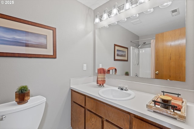 bathroom with vanity, toilet, and a shower with shower curtain