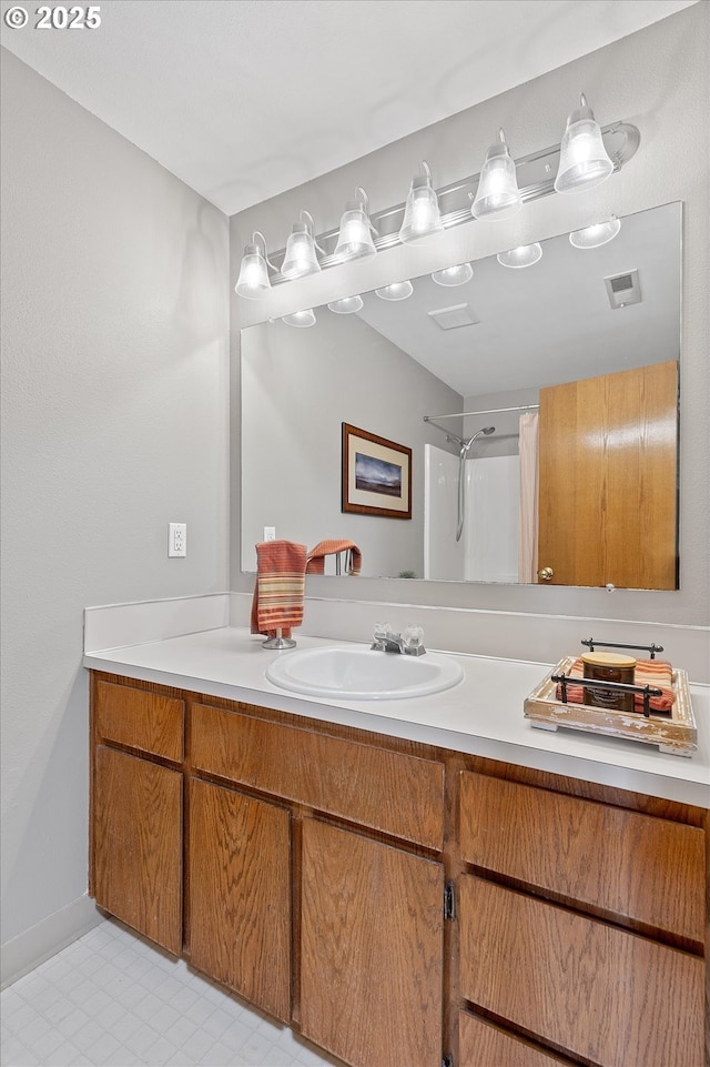 bathroom with vanity and a shower with shower curtain