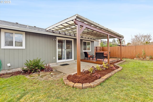 back of house featuring a yard, a pergola, and a patio