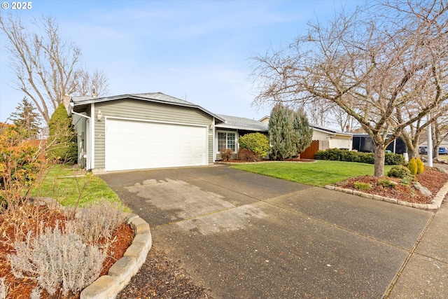 ranch-style home featuring a garage and a front lawn