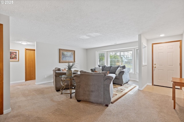 living room featuring light carpet and a textured ceiling