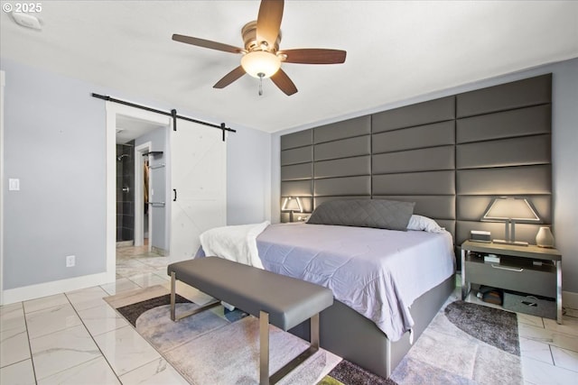 14510 NE 50th St, Vancouver, WA 98682 - bedroom featuring light marble finish floors, a barn door, and a ceiling fan