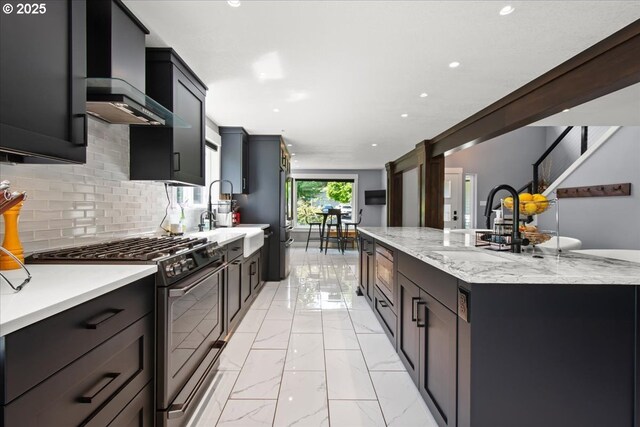 14510 NE 50th St, Vancouver, WA 98682 - kitchen with range with gas cooktop, wall chimney range hood, tasteful backsplash, recessed lighting, and a center island