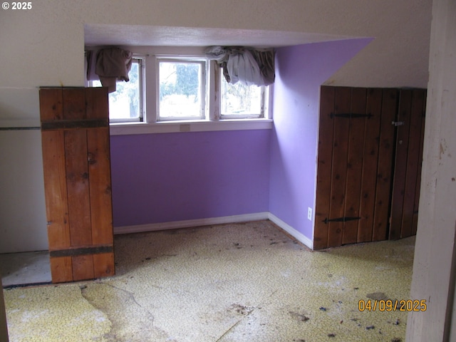 interior space featuring baseboards