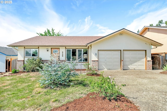 590 Granite Pl, Springfield, OR 97477 - ranch-style home with brick siding, an attached garage, and driveway