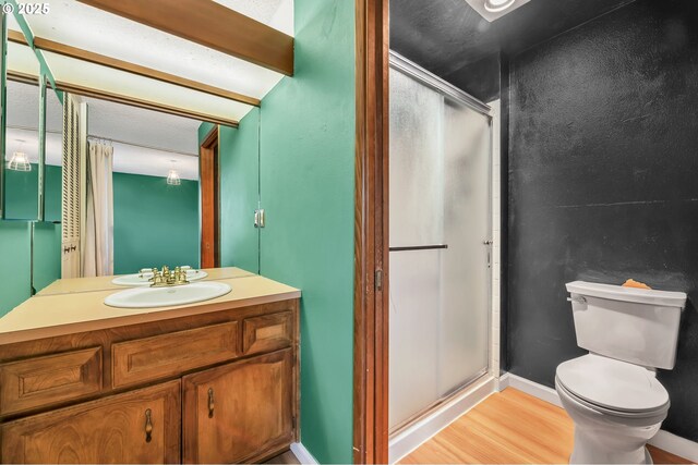 590 Granite Pl, Springfield, OR 97477 - full bath featuring a shower stall, vanity, and wood finished floors