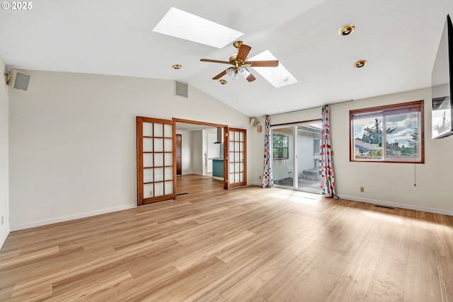 590 Granite Pl, Springfield, OR 97477 - spare room with a skylight, lofted ceiling, light wood-style flooring, a ceiling fan, and french doors