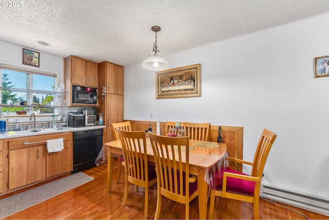 2710 SE 138th Ave Unit 48, Portland, OR 97236 - dining space with baseboard heating, dark wood finished floors, and a textured ceiling
