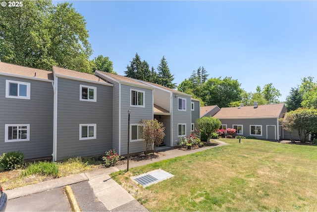 2710 SE 138th Ave Unit 48, Portland, OR 97236 - back of house with a yard