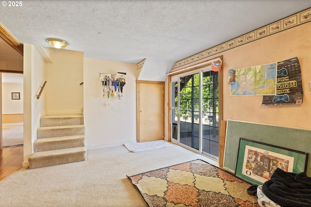 410 W Jefferson St, Carlton, OR 97111 - carpeted entryway featuring stairway, a textured ceiling, and baseboards