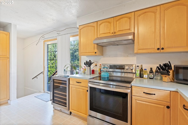 410 W Jefferson St, Carlton, OR 97111 - kitchen with stainless steel appliances, wine cooler, under cabinet range hood, light countertops, and a textured ceiling