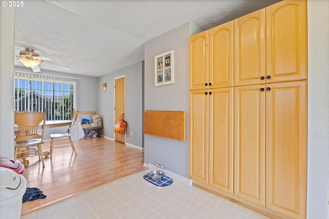 410 W Jefferson St, Carlton, OR 97111 - hall featuring tile patterned floors, a textured ceiling, and baseboards