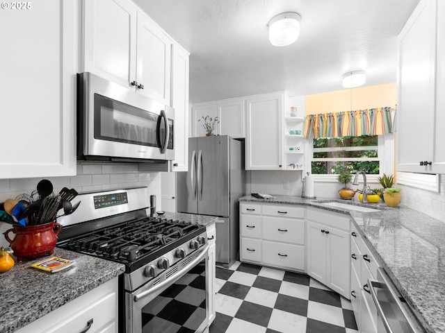 5665 Bonita Rd, Lake Oswego, OR 97035 - kitchen featuring stainless steel appliances, light flooring, decorative backsplash, and white cabinets