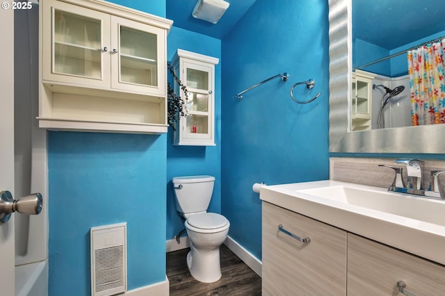 600 NE 144th Ave, Vancouver, WA 98684 - full bathroom with toilet, wood finished floors, baseboards, vanity, and heating unit