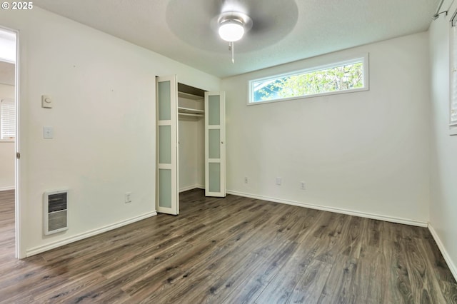 600 NE 144th Ave, Vancouver, WA 98684 - unfurnished bedroom with wood finished floors, heating unit, baseboards, a closet, and a ceiling fan