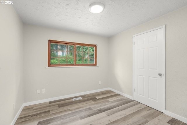 14108 NE 49th St, Vancouver, WA 98682 - spare room with a textured ceiling, light wood-style flooring, and baseboards