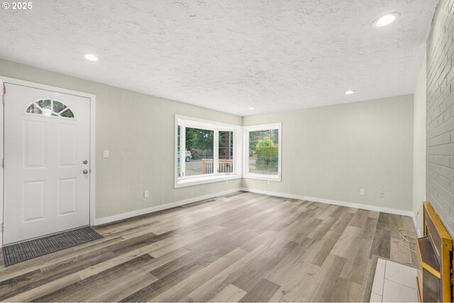 14108 NE 49th St, Vancouver, WA 98682 - entrance foyer with wood finished floors, baseboards, a textured ceiling, and recessed lighting