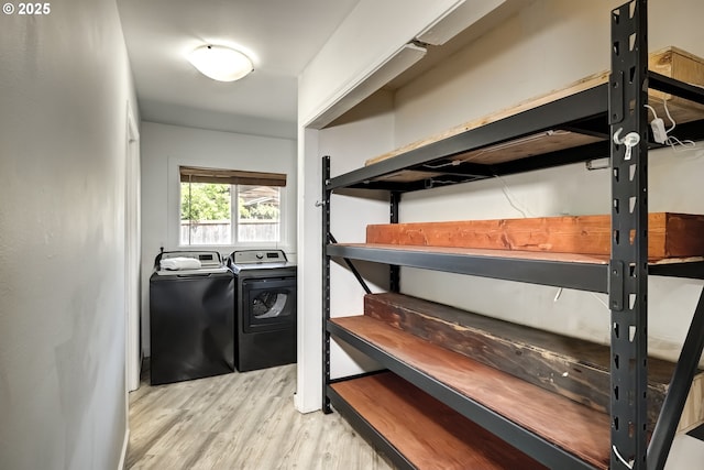 storage featuring washer and clothes dryer