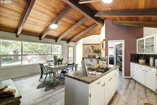 kitchen featuring wooden ceiling, light wood-style flooring, plenty of natural light, glass insert cabinets, and white cabinetry