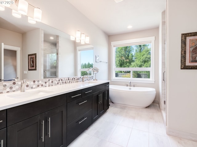 1856 NW Sierra Way, Camas, WA 98607 - bathroom featuring double vanity, a stall shower, a soaking tub, and recessed lighting