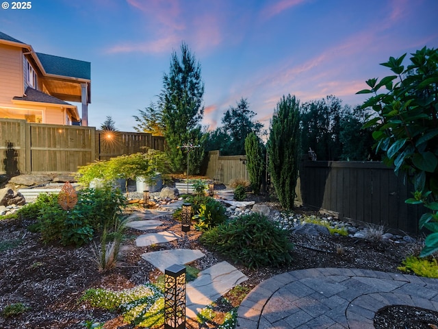 1856 NW Sierra Way, Camas, WA 98607 - yard at dusk featuring a fenced backyard and a patio area